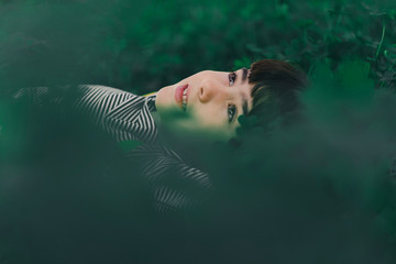 Portrait of little daydreaming girl in nature