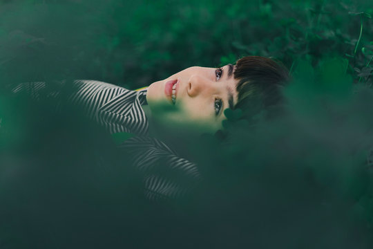 Portrait of little daydreaming girl in nature