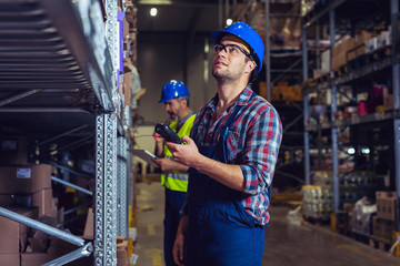 Male warehouse worker with bar code scanner