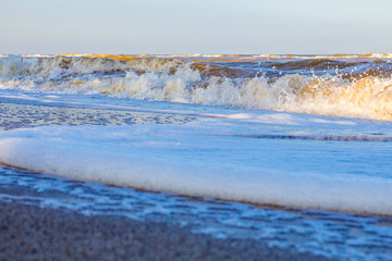 Waves on the sea near the sandy beach