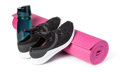 Sport shoes and yoga mat