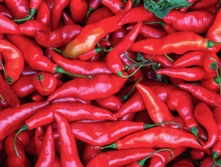 A heap of red chili peppers. Captured at the local traditional market of the colonial town of Villa de leyva, in the Andean mountains of central Colombia.