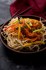 American chop suey/ chopsuey is a popular indochinese food. served in a bowl with chop sticks. selective focus