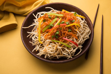 American chop suey/ chopsuey is a popular indochinese food. served in a bowl with chop sticks. selective focus