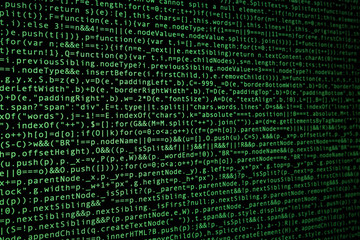 Software source code on dark background. Programming javascript code on computer screen. Console on real retina screen with pixels visible. Perspective view.