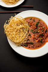 American chop suey/ chopsuey is a popular indochinese food. served in a bowl with chop sticks. selective focus