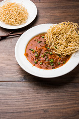 American chop suey/ chopsuey is a popular indochinese food. served in a bowl with chop sticks. selective focus
