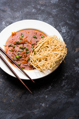 American chop suey/ chopsuey is a popular indochinese food. served in a bowl with chop sticks. selective focus