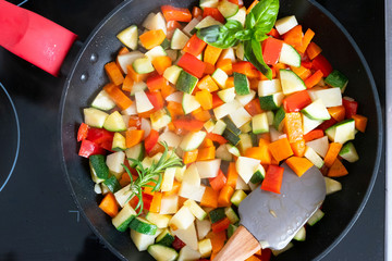 Close up view of the small pieces of vegetables cooked and ready to be eated. Colorful and delicious