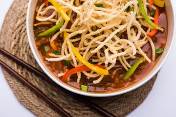 American chop suey/ chopsuey is a popular indochinese food. served in a bowl with chop sticks. selective focus