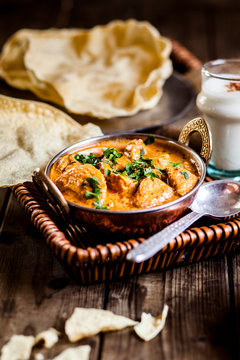 Indian Butter Chicken with Papadam, rice, and lassi