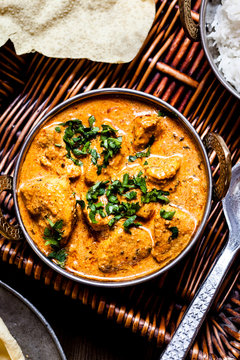 Indian Butter Chicken with Papadam and rice
