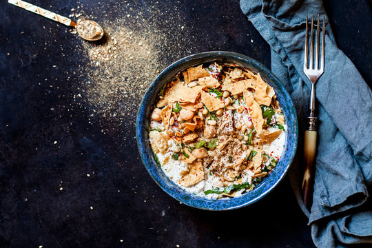 Chicken Fatteh, Lebanese chicken salad with chickpeas, yogurt, fried flat bread and zaatar