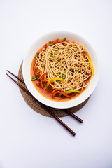 American chop suey/ chopsuey is a popular indochinese food. served in a bowl with chop sticks. selective focus