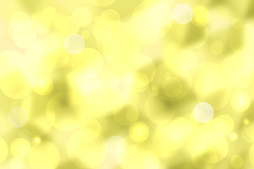 Obraz premium A festive abstract golden yellow gradient background texture with glitter defocused sparkle bokeh circles. Card concept for Happy New Year, party invitation, valentine or other holidays.