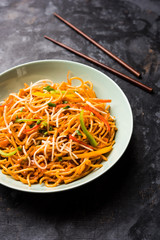 American chop suey/ chopsuey is a popular indochinese food. served in a bowl with chop sticks. selective focus