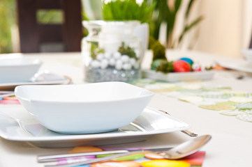 Easter table setting with white crockery