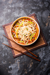 American chop suey/ chopsuey is a popular indochinese food. served in a bowl with chop sticks. selective focus