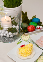 Easter table setting with colorful home decorations
