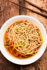 American chop suey/ chopsuey is a popular indochinese food. served in a bowl with chop sticks. selective focus
