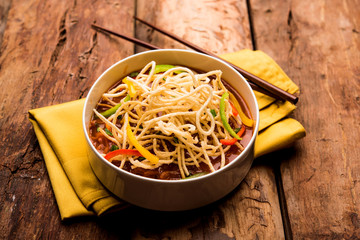 American chop suey/ chopsuey is a popular indochinese food. served in a bowl with chop sticks. selective focus