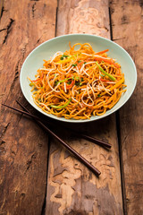 American chop suey/ chopsuey is a popular indochinese food. served in a bowl with chop sticks. selective focus