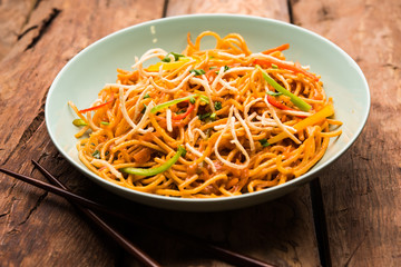 American chop suey/ chopsuey is a popular indochinese food. served in a bowl with chop sticks. selective focus
