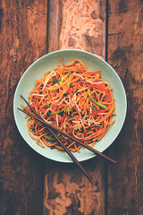 American chop suey/ chopsuey is a popular indochinese food. served in a bowl with chop sticks. selective focus