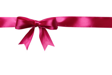 Pink bow and ribbon on a white background