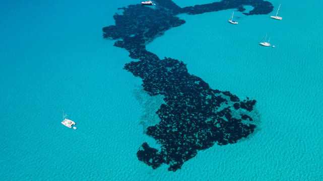 Amazing drone aerial landscape of the charming beach Es Trencs. It has earned the reputation of Caribbean beach of Mallorca. Spain