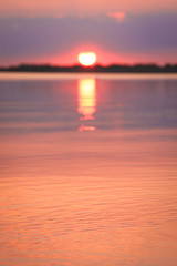 Selective focus on water surface during the sunset