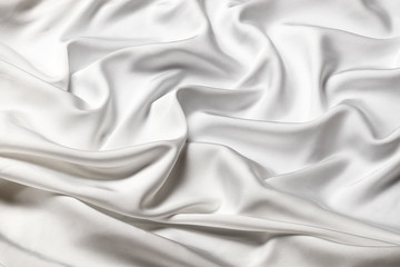 Fototapeta na wymiar Smooth elegant white silk or satin luxury cloth texture can use as wedding background. Luxurious background design
