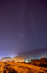 Beautiful landscape. Night sky with stars in the Carpathian mountains.