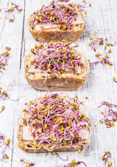 Fototapeta na wymiar Sandwiches with ham and kale sprouts as an ingredient of a healthy diet.