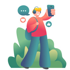 young guy walking on the street and making selfie on smartphone