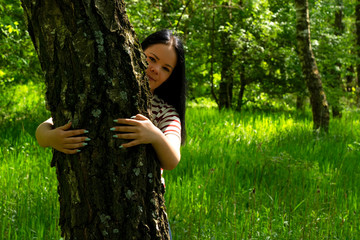 Young girl in forest is spring time
