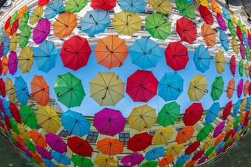 Fototapeta na wymiar Background with colored umbrellas