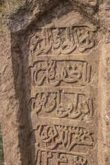Ancient muslim cemetery near Agstafa, Azerbaijan with writings on farsi for graphic and web design, for website or mobile app.