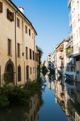 Fototapeta na wymiar apartments along canal in Padua, Italy