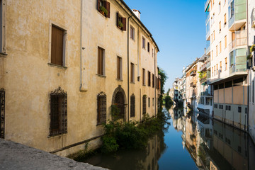 Fototapeta na wymiar apartments along canal in Padua, Italy