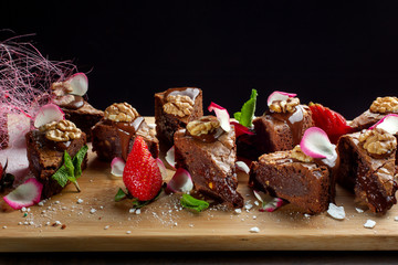 Homemade chocolate brownies or chocolate cakes with nuts.
