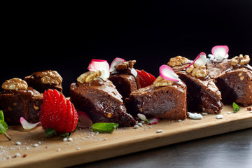 Homemade chocolate brownies or chocolate cakes with nuts.