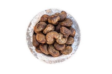 Cashew - bowl filled of raw nuts in the shell