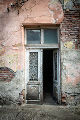 Old doors of old ruined abandoned house