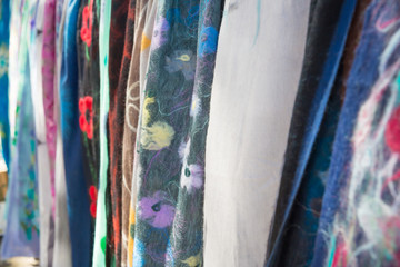 Photo of wool scarfes on Dry Bridge flea market in Tbilisi for graphic and web design, for website or mobile app.