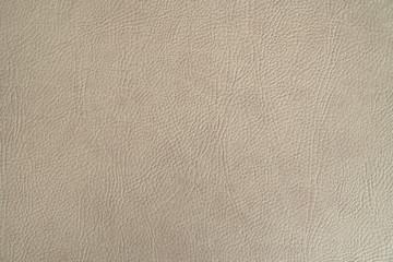 Fototapeta premium Beige leather texture closeup, useful as background.