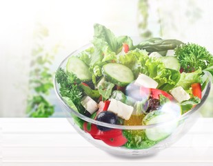 Closeup of Greek salad with feta cheese, cherry tomatoes and lettuce