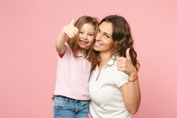 Woman in light clothes have fun with cute child baby girl. Mother, little kid daughter isolated on...