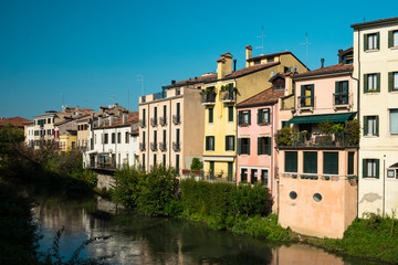 Fototapeta na wymiar colorful houses along canal in Padua, Italy
