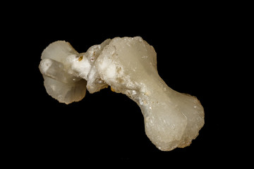 Macro of a stone Stilbite mineral on a black background
